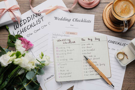 Flat lay composition with Wedding Checklists on wooden tableの写真素材