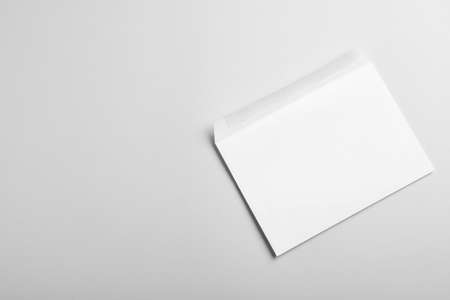 White paper envelope on light gray background, top view. Space for textの写真素材