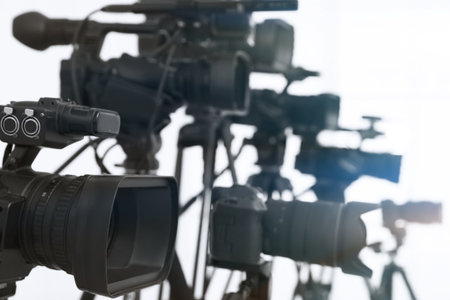 Modern video cameras indoors, closeup. Professional media equipment for broadcasting eventsの写真素材