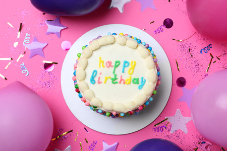 Cute bento cake with tasty cream and decor on pink background, flat lay