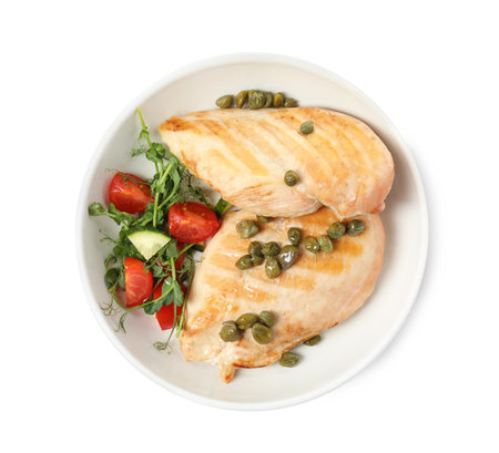 Delicious cooked chicken fillets with capers and salad on white background, top viewの写真素材