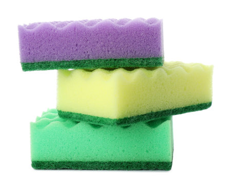 Bright cleaning sponges with abrasive scourers on white backgroundの写真素材