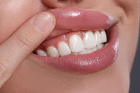 Young woman showing healthy gums, closeup viewの写真素材