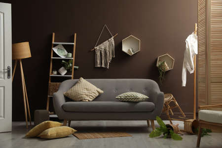 View on messy living room interior after earthquake
