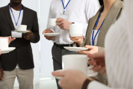 Group of people during coffee break, closeupの写真素材
