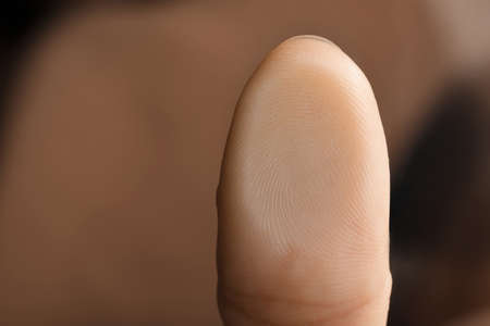 Woman pressing finger to surface, closeup view. Scanning fingerprintの写真素材