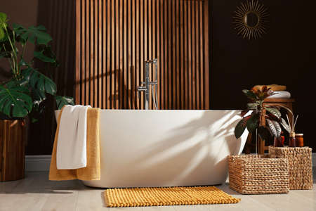Cozy bathroom interior with stylish ceramic tubの写真素材