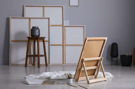 Stylish artist's studio interior with canvas and brushesの写真素材
