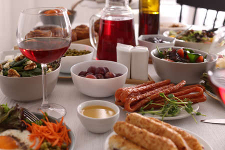 Many different dishes served on buffet table for brunch