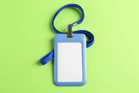 Blank badge on green background, top view. Mockup for design
