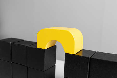 Bridge made of blocks on gray background, closeup. Connection, relationships and deal conceptの写真素材