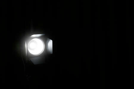 Bright spotlight in darkness, space for text. professional stage equipmentの写真素材