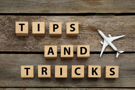 Phrase Tips and Tricks made with cubes on wooden table, flat layの写真素材