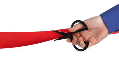 Man cutting red ribbon on white background, closeupの写真素材