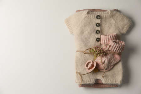 Set of baby clothes and accessories on light background, top view. Space for textの写真素材