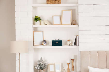 Wall shelves with beautiful decor elements indoors. interior designの写真素材