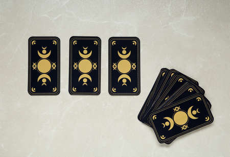 Tarot cards on light table, flat lay. reverse sideの写真素材