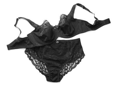 Elegant black plus size women's underwear on white background, top view