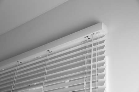 Window with closed blinds in room, low angle viewの写真素材