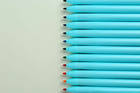 Many colorful markers on light background, flat lay. Space for textの写真素材