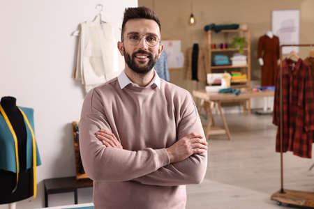 Portrait of professional dressmaker in modern workshopの写真素材