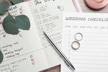 Flat lay composition with Wedding Checklist and planner on wooden tableの写真素材