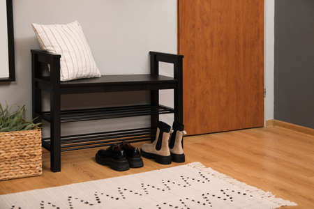 Modern hallway interior with shoe rack near doorの写真素材