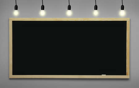 Glowing light bulbs and blackboard hanging on light gray wallの写真素材