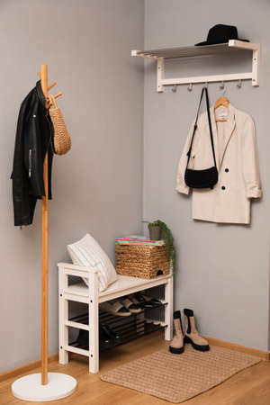 Modern hallway interior with shoe rack and wooden coat standの写真素材