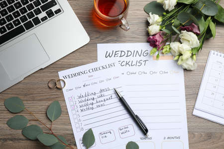 Flat lay composition with Wedding Checklists on wooden tableの写真素材