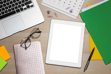 Modern gadgets, glasses and office stationery on wooden table, flat lay. distance learning