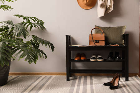 Hallway interior with stylish furniture, clothes and accessoriesの写真素材