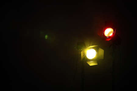Bright colorful spotlights in darkness, space for textの写真素材