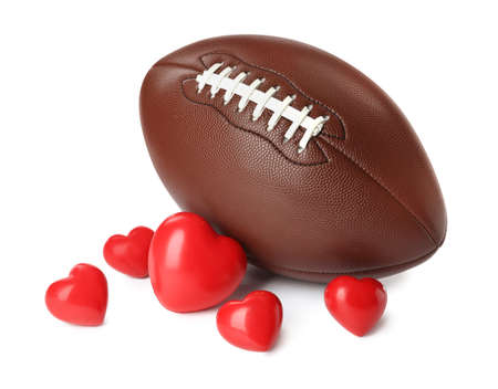 American football ball and hearts on white backgroundの写真素材