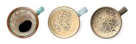 Set of mugs with aromatic hot coffee on white background, top view. banner design
