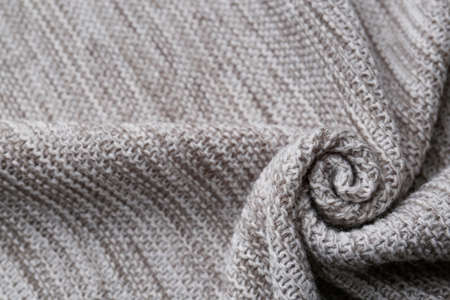 Beautiful gray knitted fabric as background, top viewの写真素材