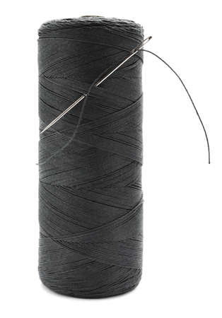 Black sewing thread with needle on white background