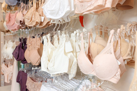 Many different beautiful women's underwear in lingerie store, closeupの写真素材