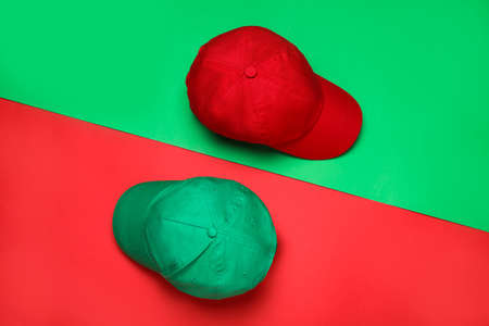 Baseball caps on color background, flat lay Mock up for designの写真素材