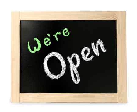 Small chalk board with phrase We're Open isolated on whiteの写真素材