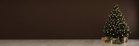 Beautifully decorated Christmas tree and gift boxes indoors, space for text. banner designの写真素材