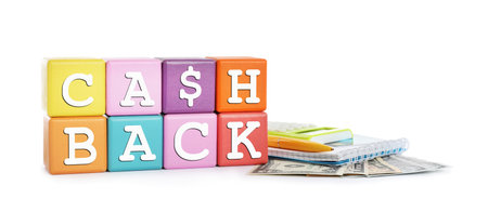 Colorful cubes with word Cashback, money, calculator and notebook on white backgroundの写真素材