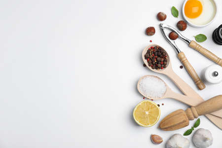 Composition with cooking utensils and fresh ingredients on white background, top view. Space for textの写真素材