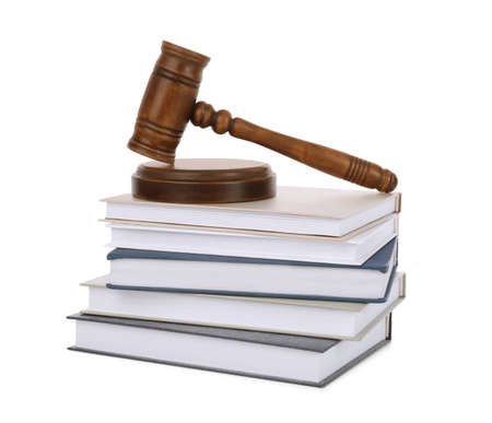 Wooden gavel and stack of books on white backgroundの写真素材