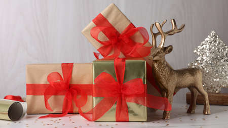 Beautifully wrapped gift boxes on white tableの写真素材