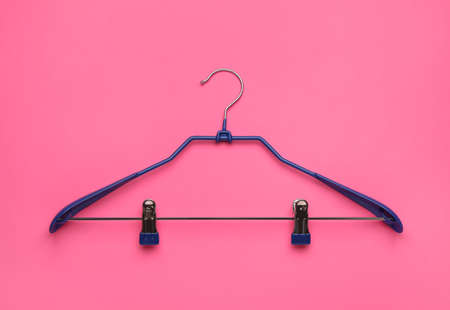 Empty hanger on pink background, top viewの写真素材