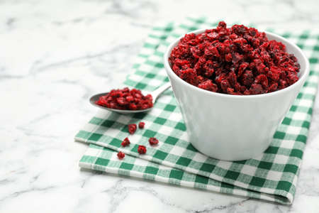 Dried red currant berries on white marble tableの写真素材