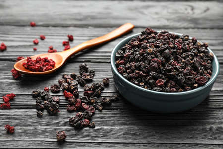 Dried black and red currant berries on wooden tableの写真素材