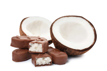 Delicious milk chocolate candy bars with coconut filling on white backgroundの写真素材