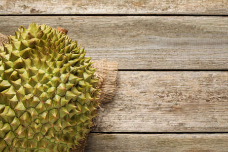 Ripe durian on wooden table, top view. Space for textの写真素材